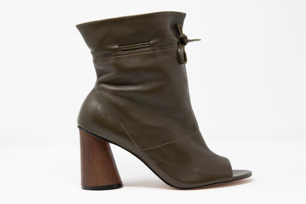 Shaz Self-Tie Leather Boots featuring a stylish design with soft leather and a rustic cone-shaped wooden heel.