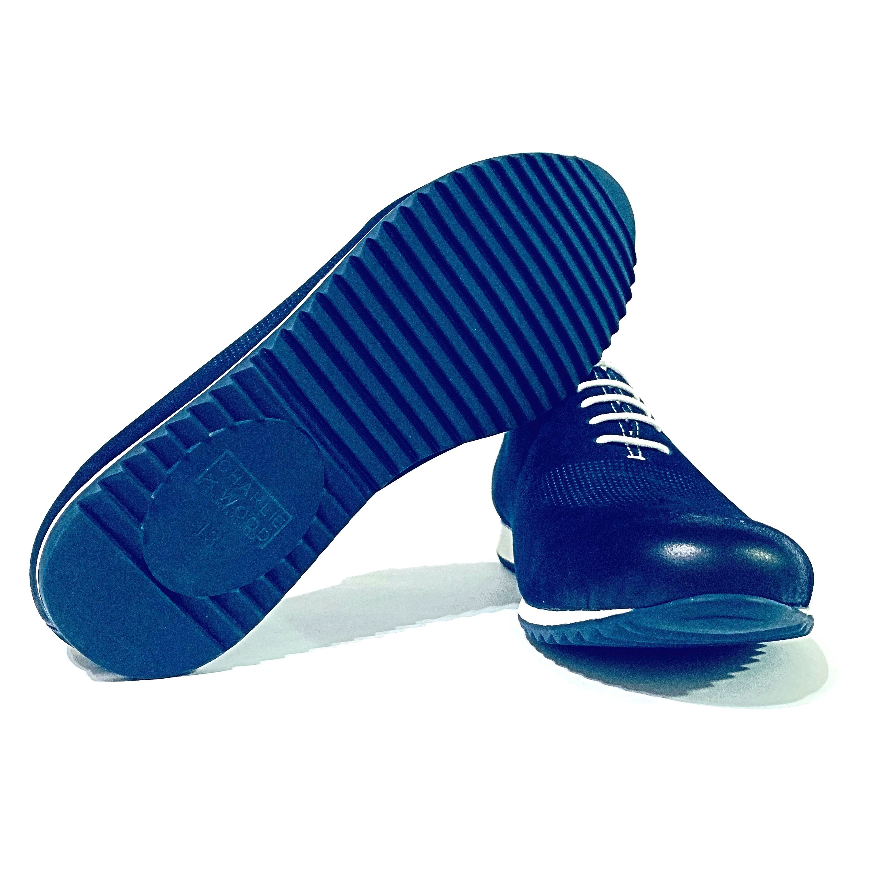 Black dress shoes with rubber soles.