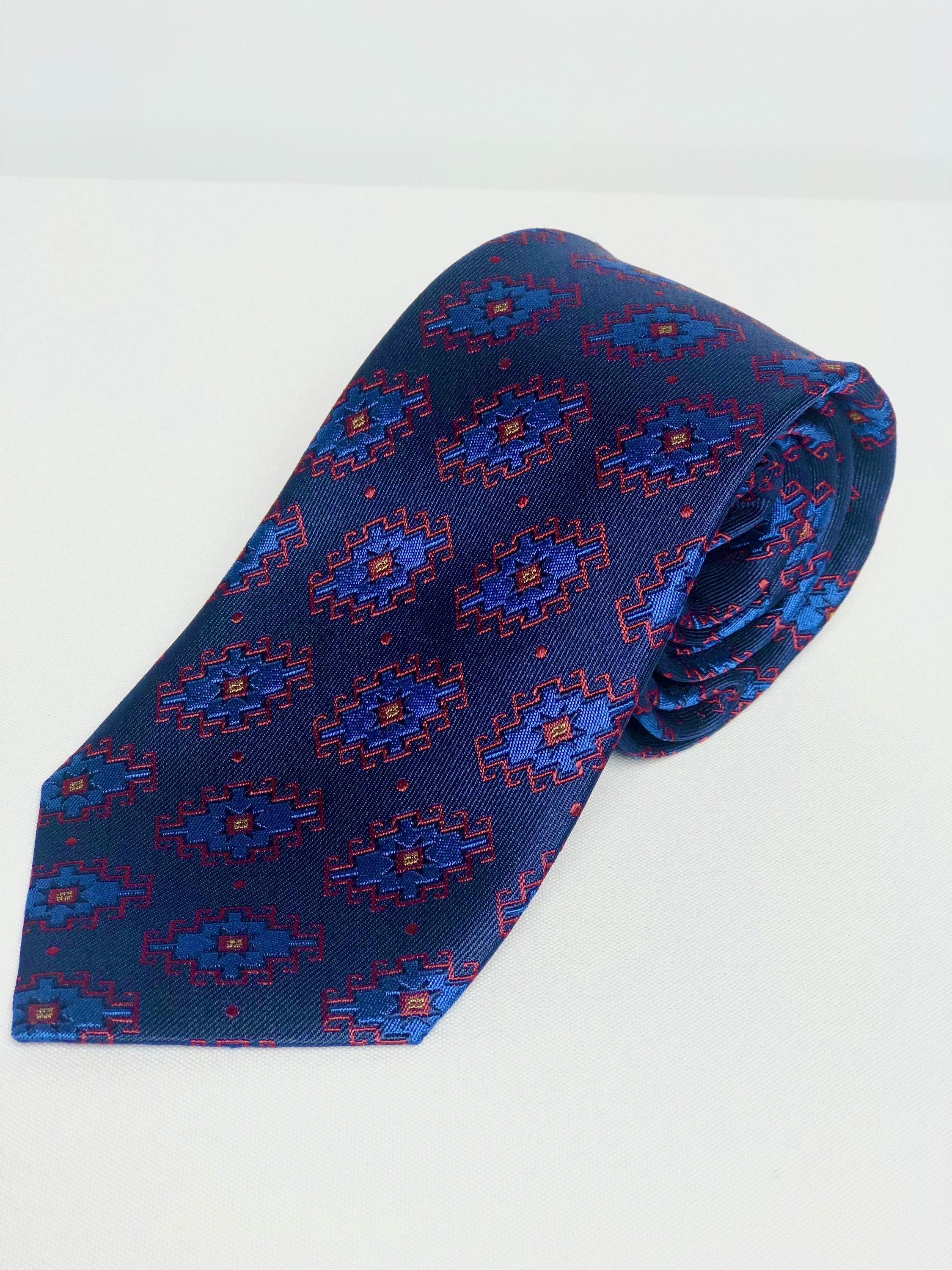 Armenian Rug Silk Neck Tie featuring intricate handmade designs in Navy/Red/Blue and Black/Gold/Green colors, showcasing luxurious silk texture.