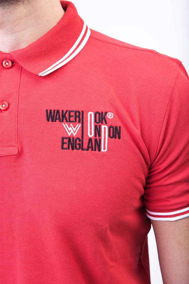 Wakerlook Men's Classic Fit Tipped Polo in red with embroidered logo, featuring a two-button placket and tipped collar and cuffs.