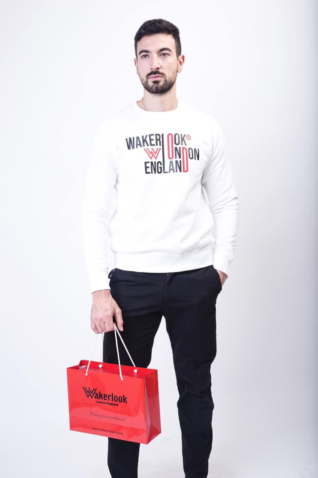 Wakerlook Graduate Heavyweight Sweat in white with stylish front print, featuring raglan sleeves and ribbed cuffs, displayed in a luxury red box.