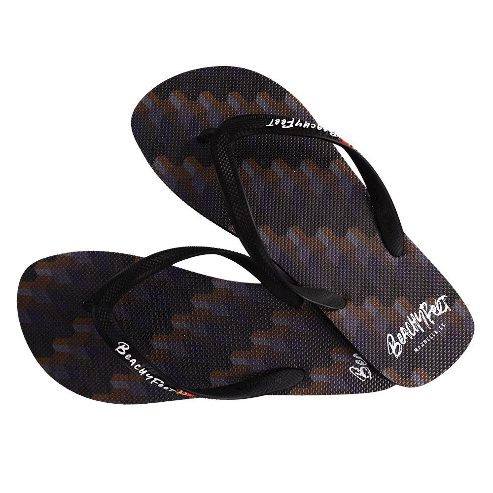 BeachyFeet® - Dame De Noche flip flops featuring a gold emblem, rugged strap, and textured footbed, perfect for summer wear.