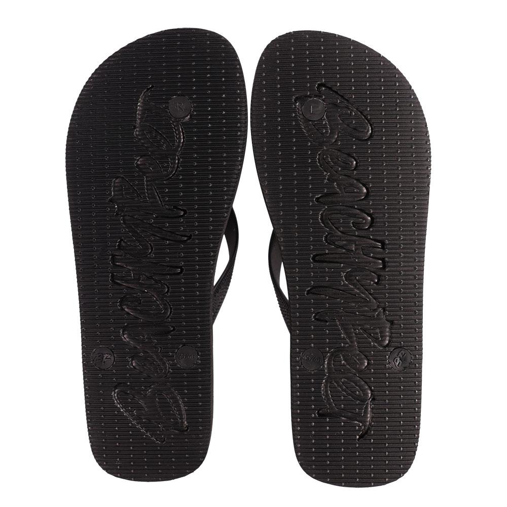 BeachyFeet® - Dame De Noche flip flops featuring a gold emblem, rugged strap, and textured footbed, perfect for summer wear.