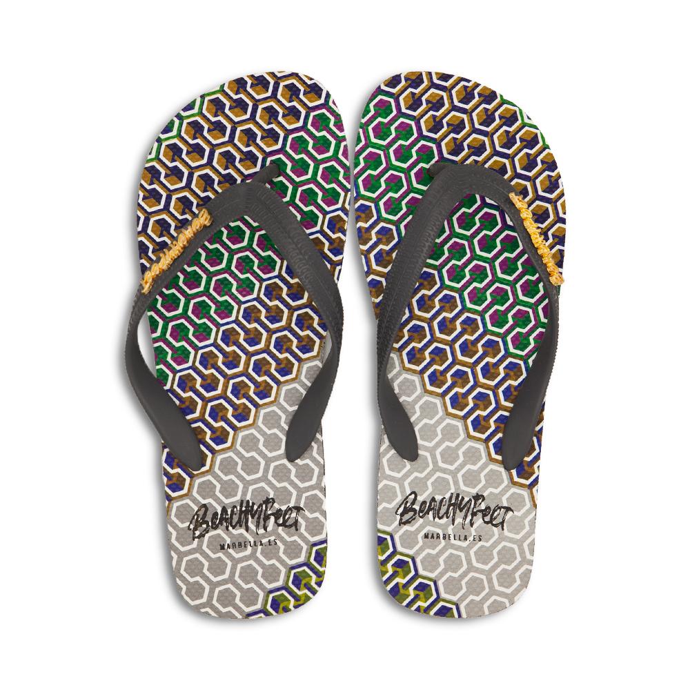 BeachyFeet® - Dreamers flip flops featuring a colorful intertwined pattern and gold emblem, perfect for beach and nightlife.