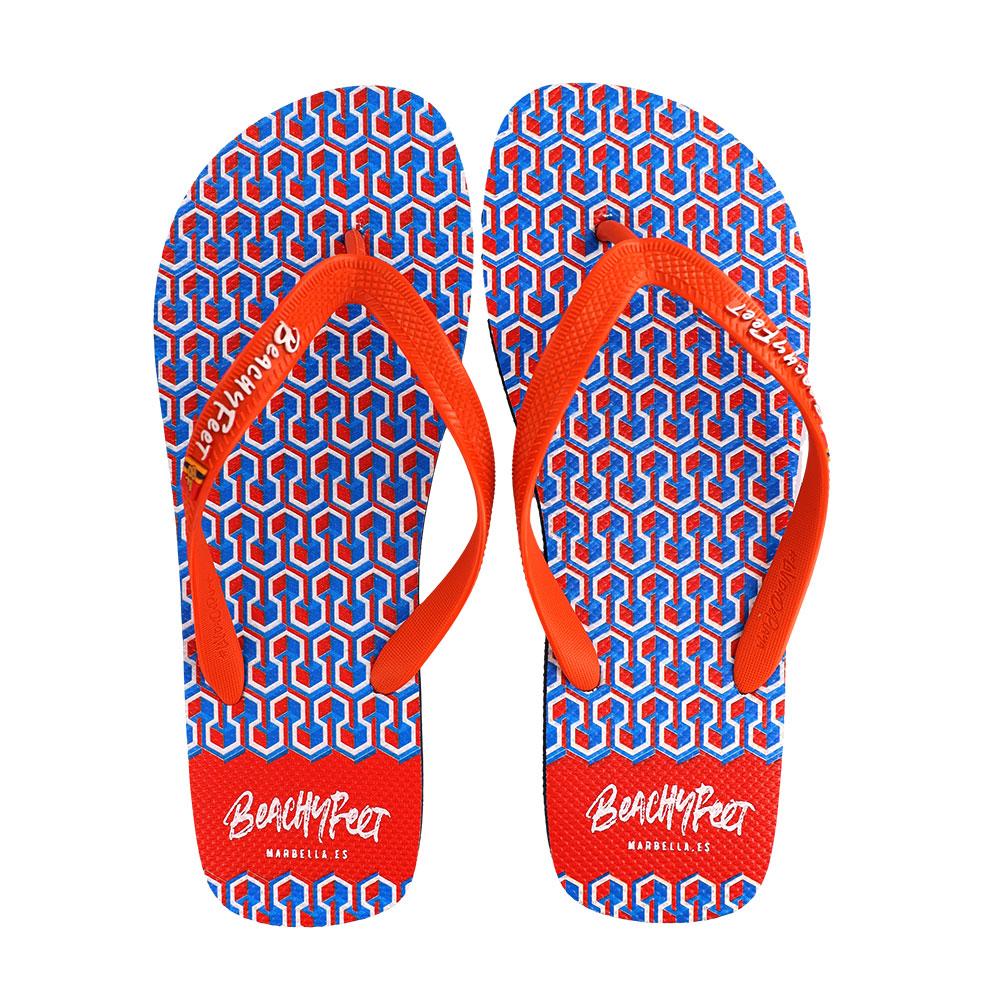 BeachyFeet® Eclipse Naranja flip flops featuring a vibrant design, gold emblem, and rugged strap, perfect for summer adventures.