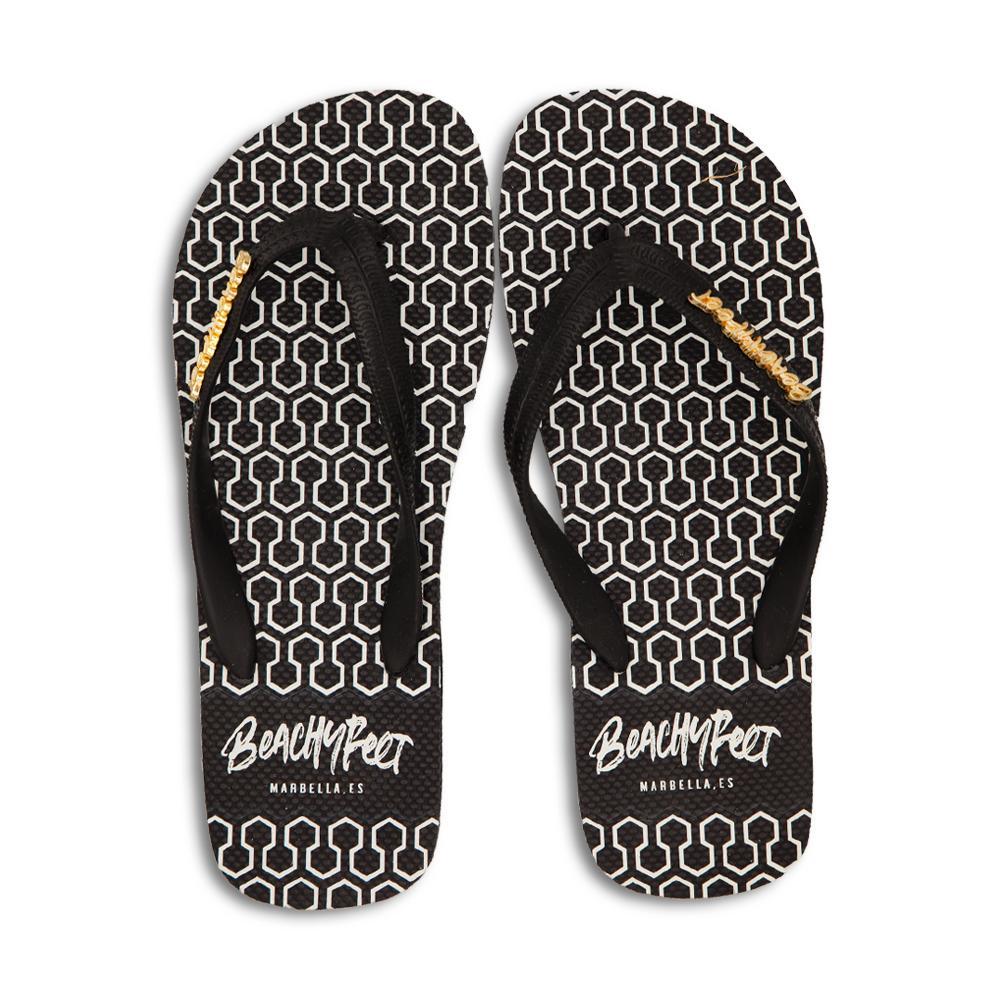 BeachyFeet® - Eclipse flip flops featuring a honeycomb geometric design in white, black, and gold, perfect for summer wear.