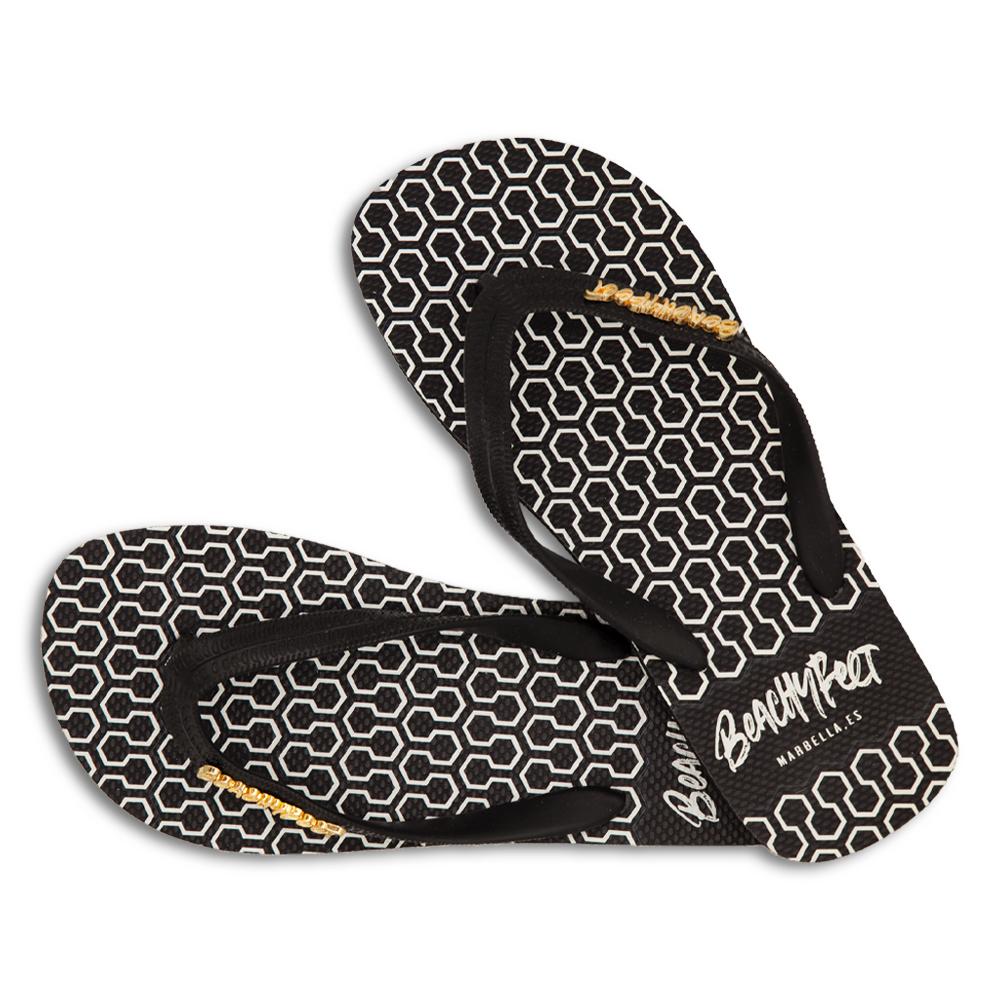 BeachyFeet® - Eclipse flip flops featuring a honeycomb geometric design in white, black, and gold, perfect for summer wear.