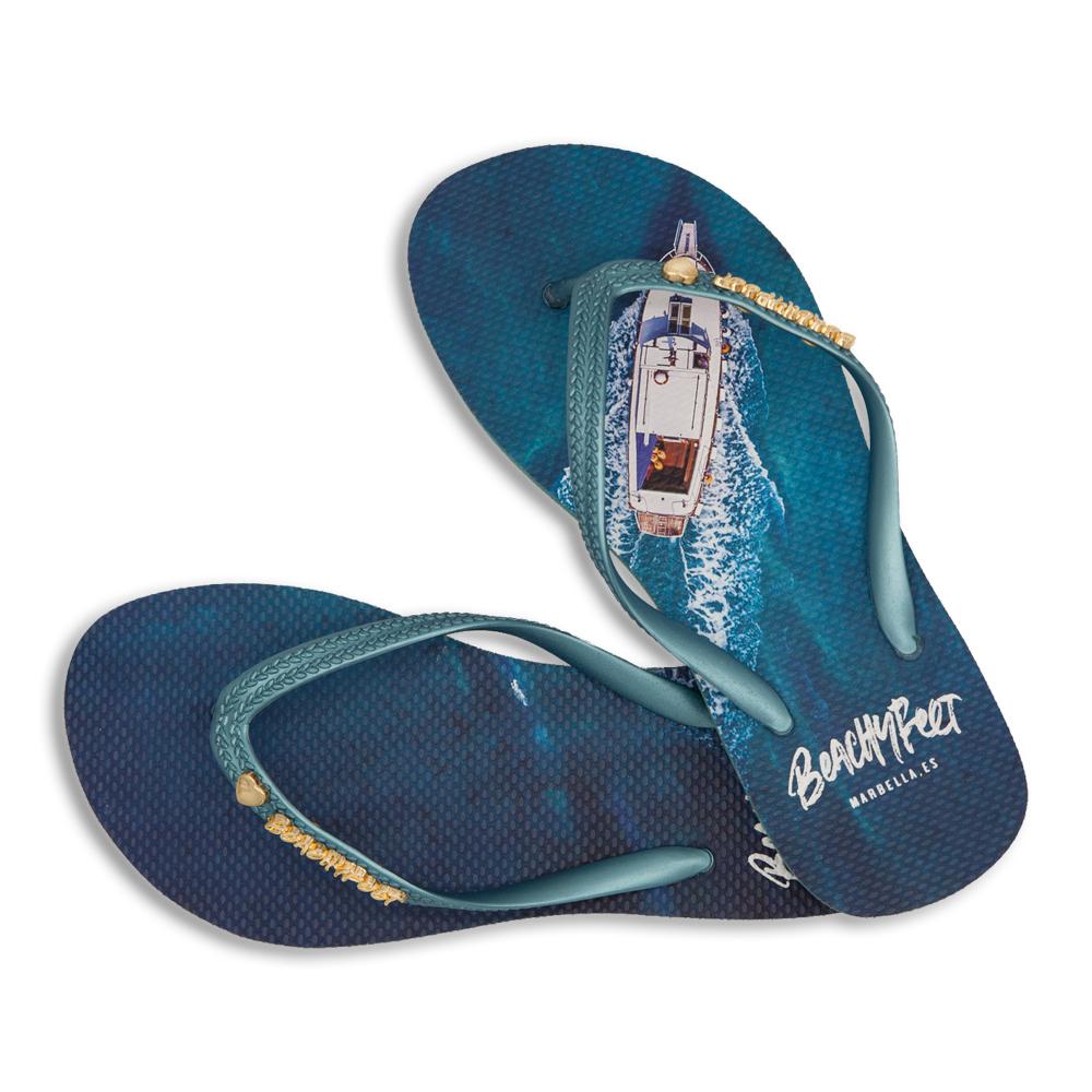 BeachyFeet® - El Oceano flip flops featuring a gold emblem, lightweight design, and textured footbed, perfect for summer activities.