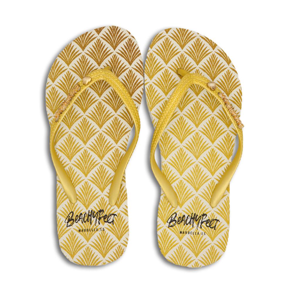 BeachyFeet® - Exótica flip flops featuring a golden palm pattern, perfect for summer beach outings.