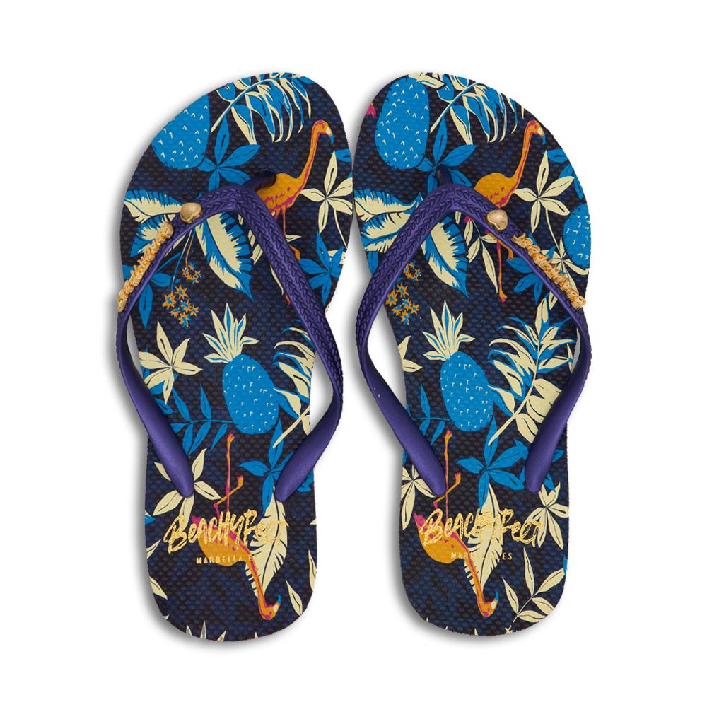 BeachyFeet® - Flamenco flip flops featuring tropical design with palms, flowers, and flamingos on a deep navy strap.