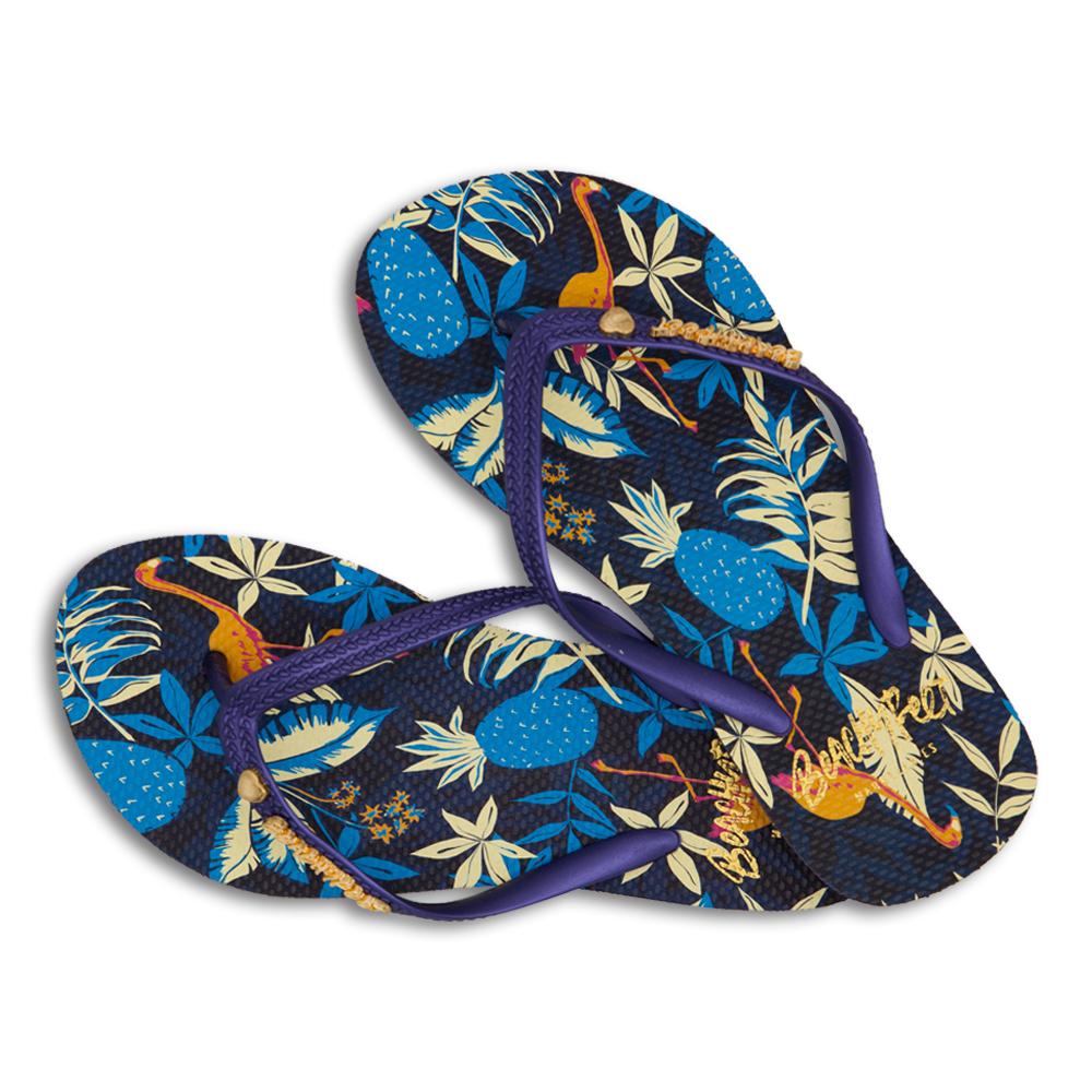 BeachyFeet® - Flamenco flip flops featuring tropical design with palms, flowers, and flamingos on a deep navy strap.