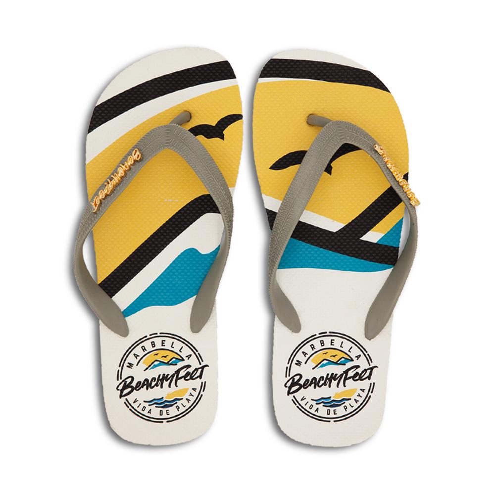 BeachyFeet® - La Concha flip flops featuring a Mediterranean-inspired design with a gold emblem, perfect for summer wear.