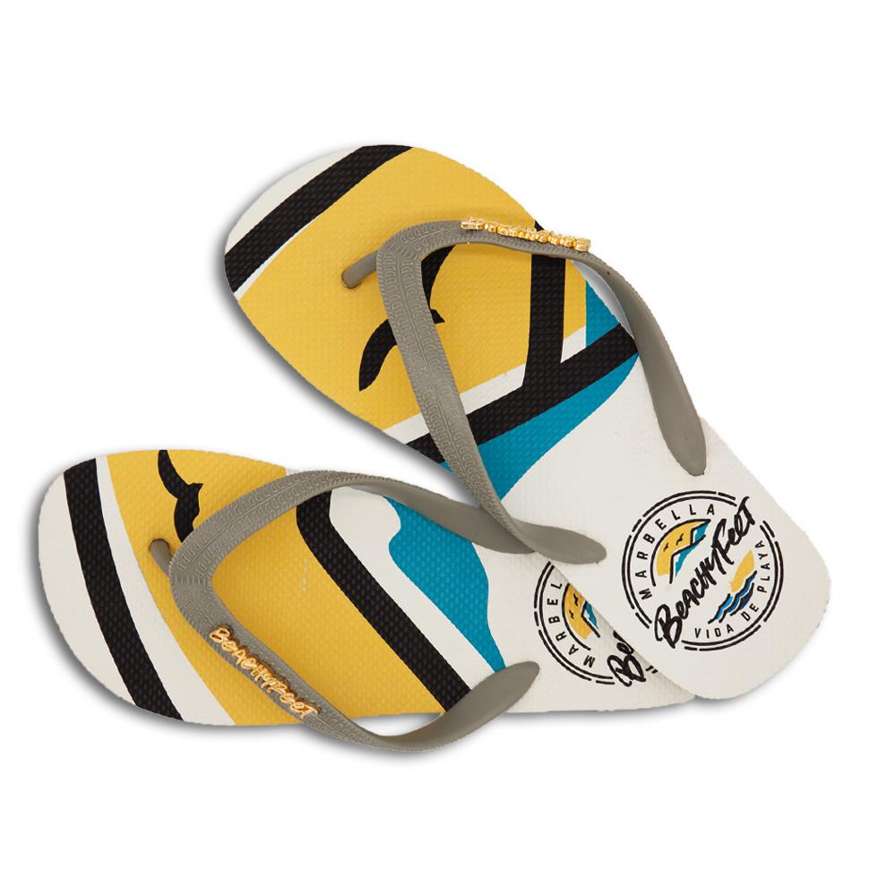 BeachyFeet® - La Concha flip flops featuring a Mediterranean-inspired design with a gold emblem, perfect for summer wear.