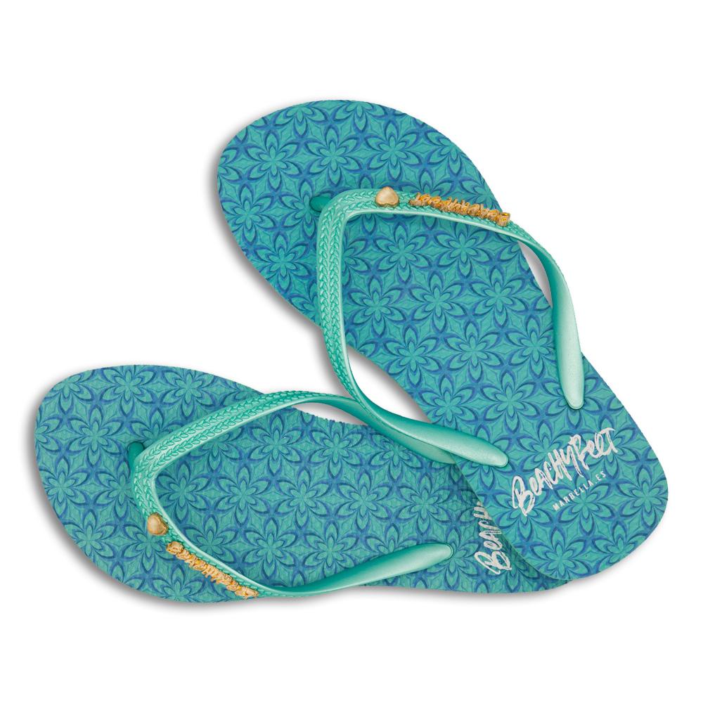 BeachyFeet® - Larimar flip flops featuring a pastel geometric floral design with a turquoise strap and gold emblem.