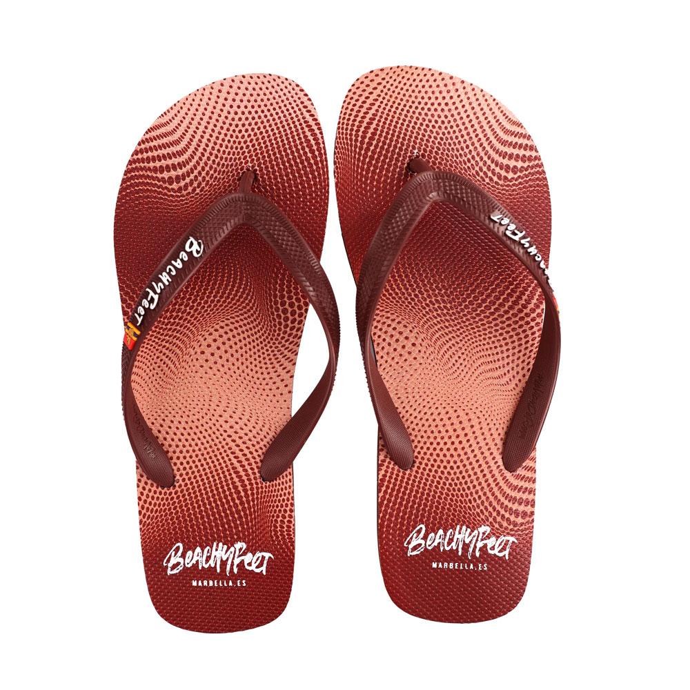 BeachyFeet® - Puntos Rojos flip flops featuring a vibrant Mediterranean-inspired design with a gold emblem.