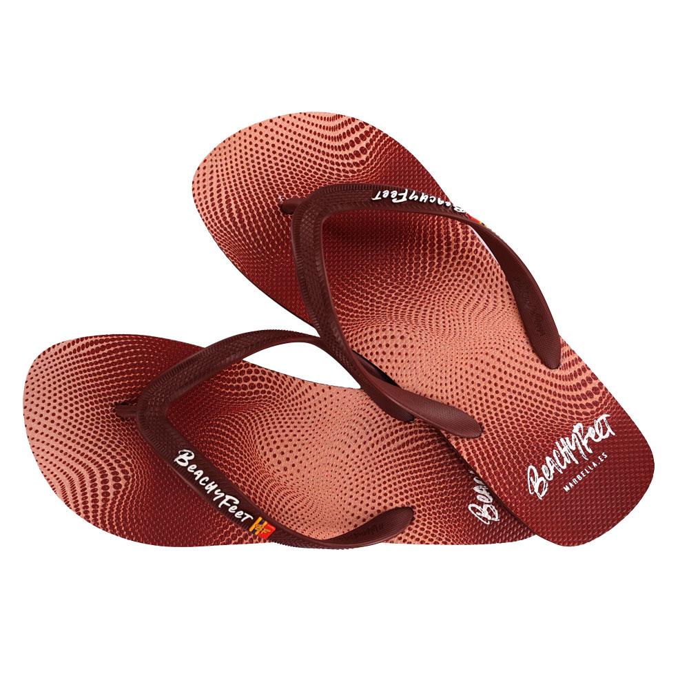 BeachyFeet® - Puntos Rojos flip flops featuring a vibrant Mediterranean-inspired design with a gold emblem.