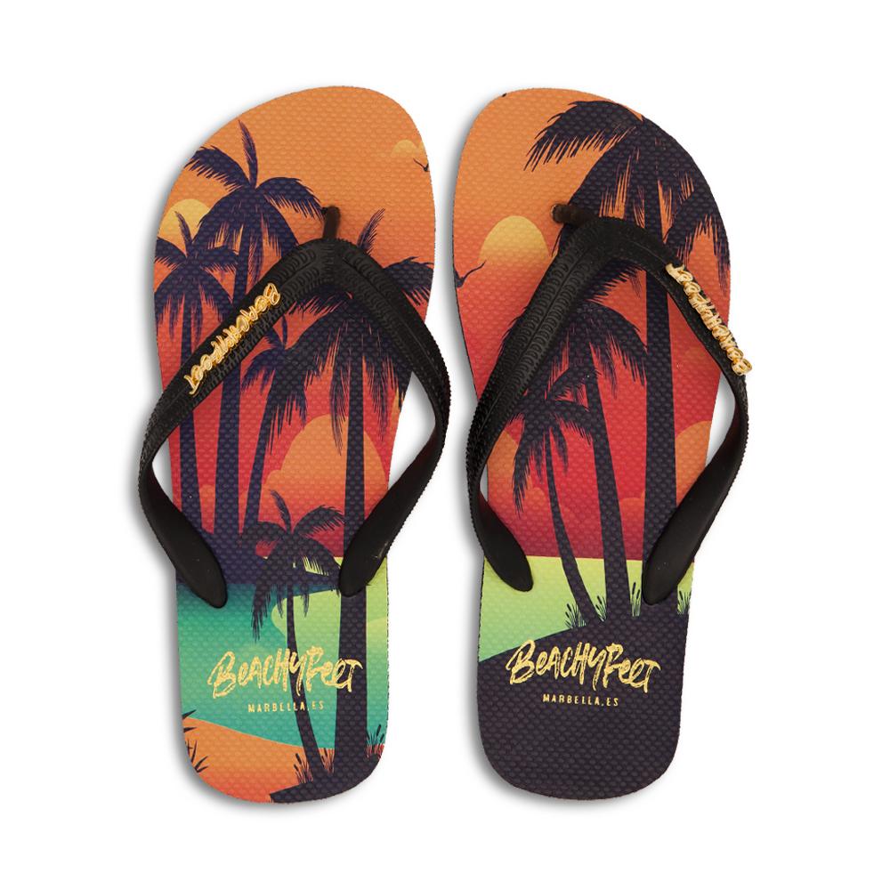 BeachyFeet® - Sunset Lover flip flops featuring a vibrant sunset and palm tree design, perfect for summer adventures.