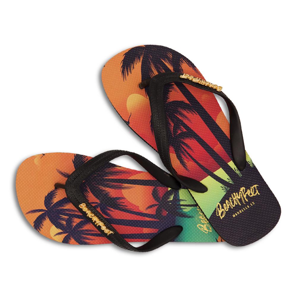 BeachyFeet® - Sunset Lover flip flops featuring a vibrant sunset and palm tree design, perfect for summer adventures.