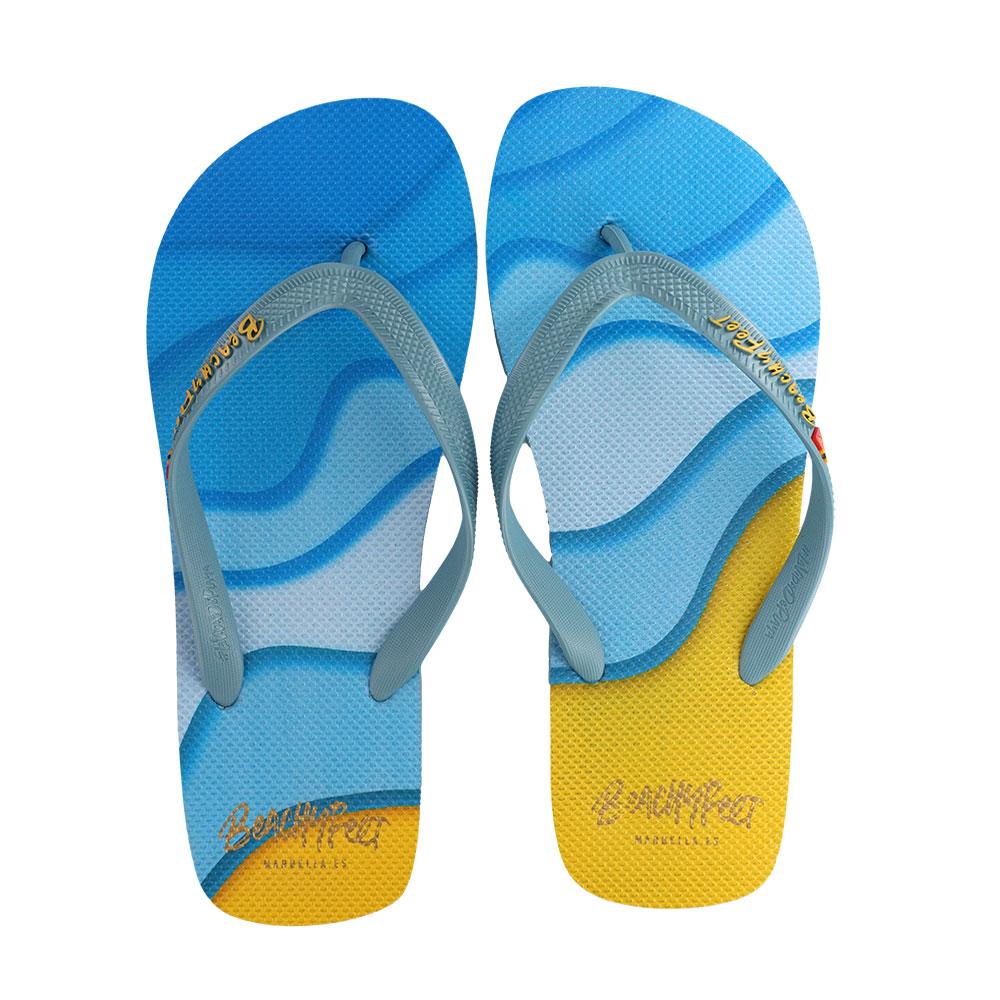 BeachyFeet® Waverider Azul Amarillo flip flops featuring a vibrant blue and yellow design, perfect for summer wear.