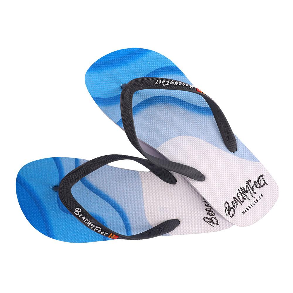 BeachyFeet® Waverider Blanco flip flops featuring a gold emblem, lightweight design, and textured footbed, perfect for summer wear.