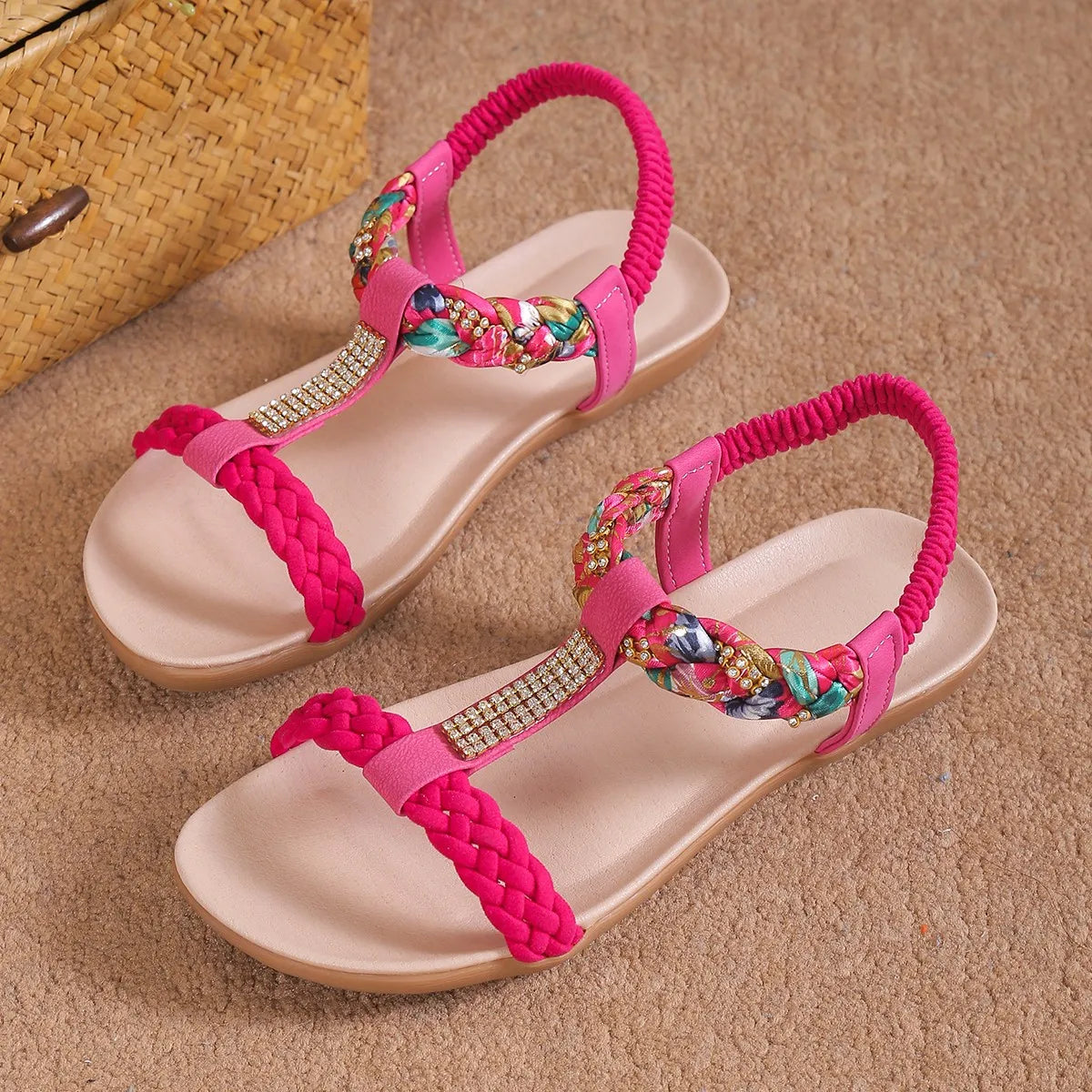 Stylish women's flat sandals featuring braided rope and rhinestones, perfect for summer wear.