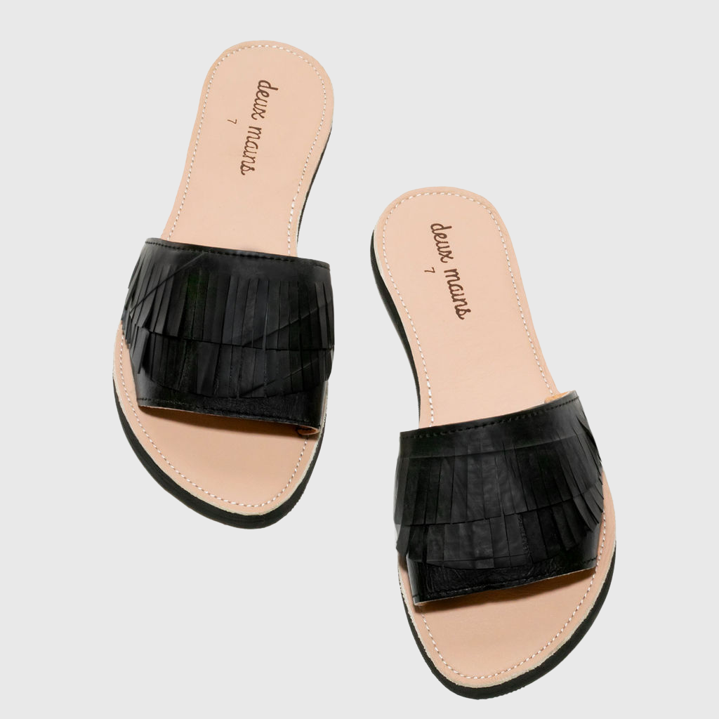 Stylish black Fringe Slide Sandal with edgy fringe detail, made from genuine leather and up-cycled materials.