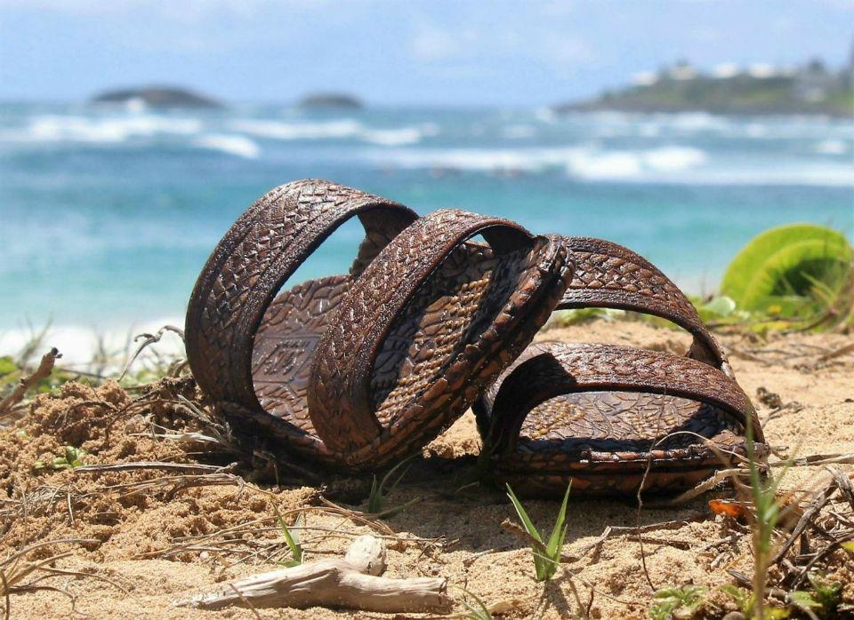 Kona J-Slips Jandals in dark brown color with weave pattern straps, showcasing their stylish design and comfortable air pocket footbed.