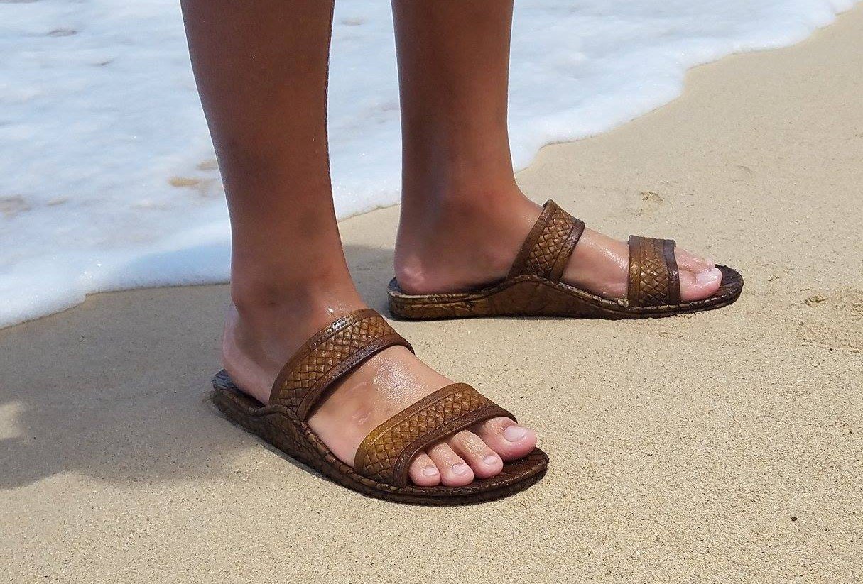 Kona J-Slips Jandals in dark brown color with weave pattern straps, showcasing their stylish design and comfortable air pocket footbed.