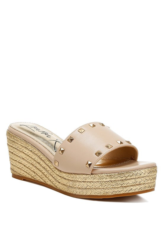 Lilja Slip On Espadrilles featuring metallic accents and stud embellishments on a woven wedge heel.