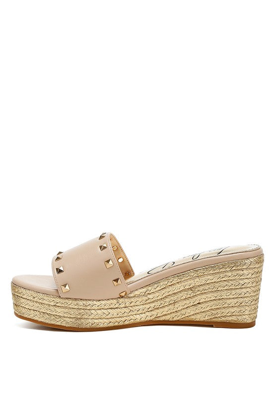 Lilja Slip On Espadrilles featuring metallic accents and stud embellishments on a woven wedge heel.