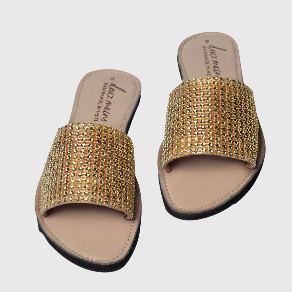 Elegant Love Wins Gold Slide sandals adorned with gold rhinestones, featuring eco-friendly repurposed tire soles for comfort and traction.