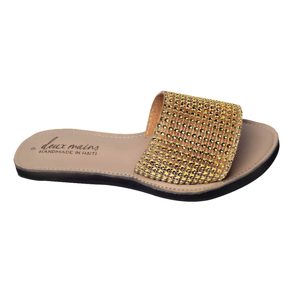 Elegant Love Wins Gold Slide sandals adorned with gold rhinestones, featuring eco-friendly repurposed tire soles for comfort and traction.