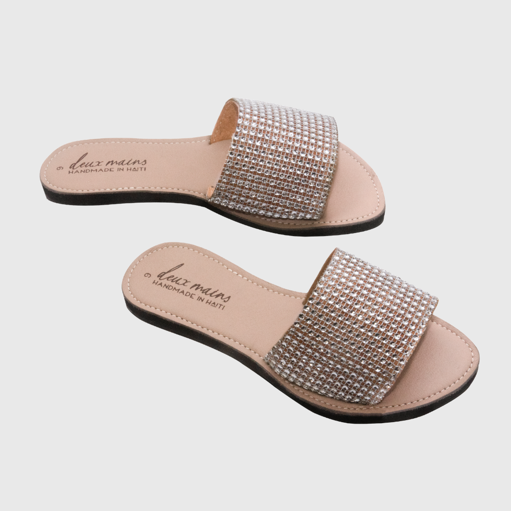 Elegant Love Wins Silver Slide sandals adorned with sparkling rhinestones and eco-friendly repurposed tire soles.