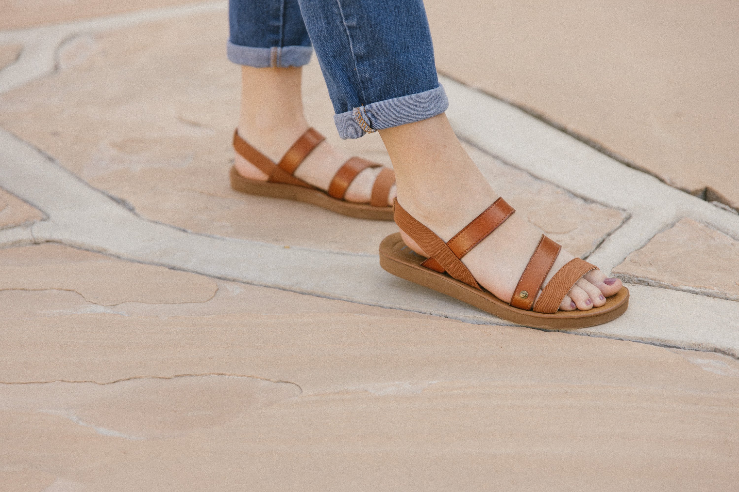 A pair of stylish Women's Sandals in Mystery Brown featuring a 1-inch flatform and stretchy sling back strap, made from faux-leather and canvas material.