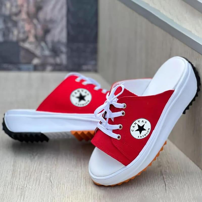 A pair of 2022 Casual Canvas Thick-soled Lace-up Women's Sandals Slippers featuring a stylish lace-up design and thick soles for comfort.