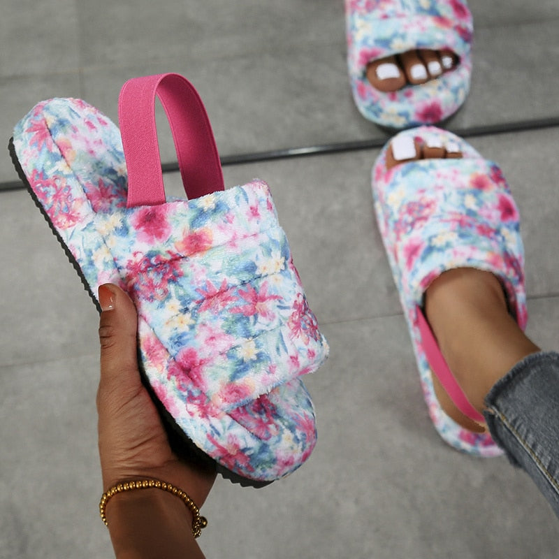 A pair of stylish black women heel slides made from elastic cloth with a thick sole, designed for comfort and modern fashion.