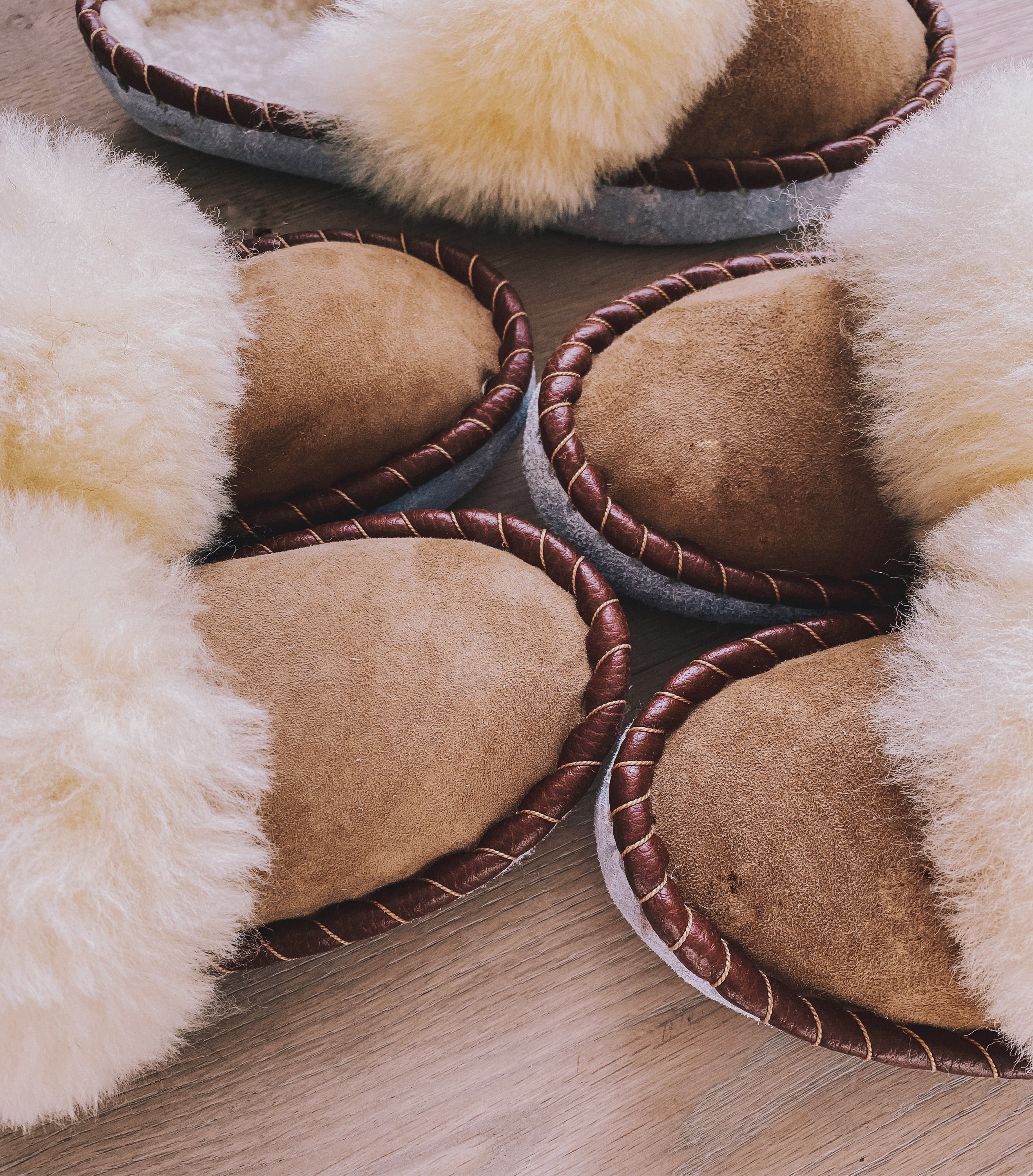 Burnt Caramel Slip Ons featuring brown leather and natural fur, showcasing a cozy and stylish design.