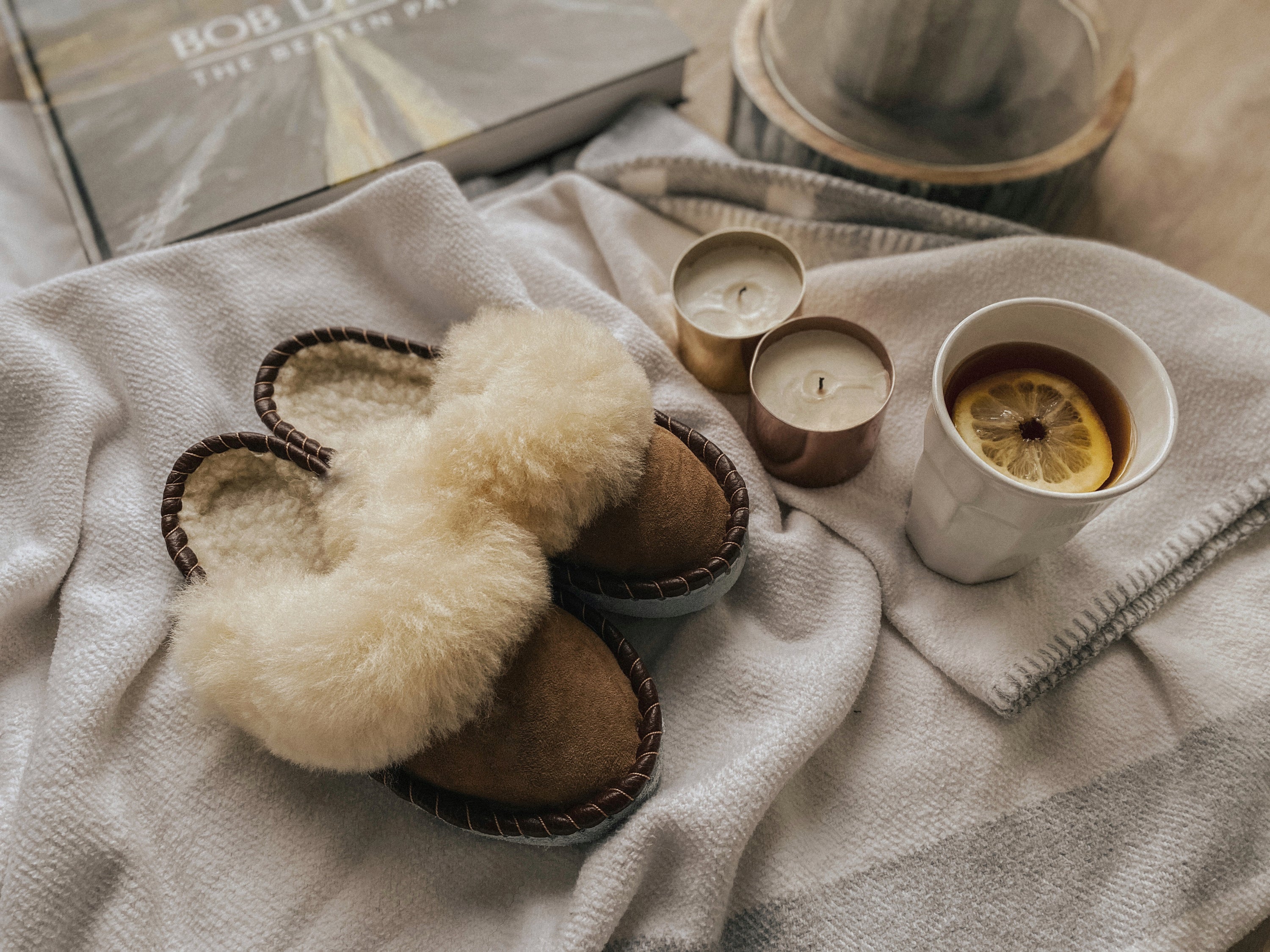 Burnt Caramel Slip Ons featuring brown leather and natural fur, showcasing a cozy and stylish design.