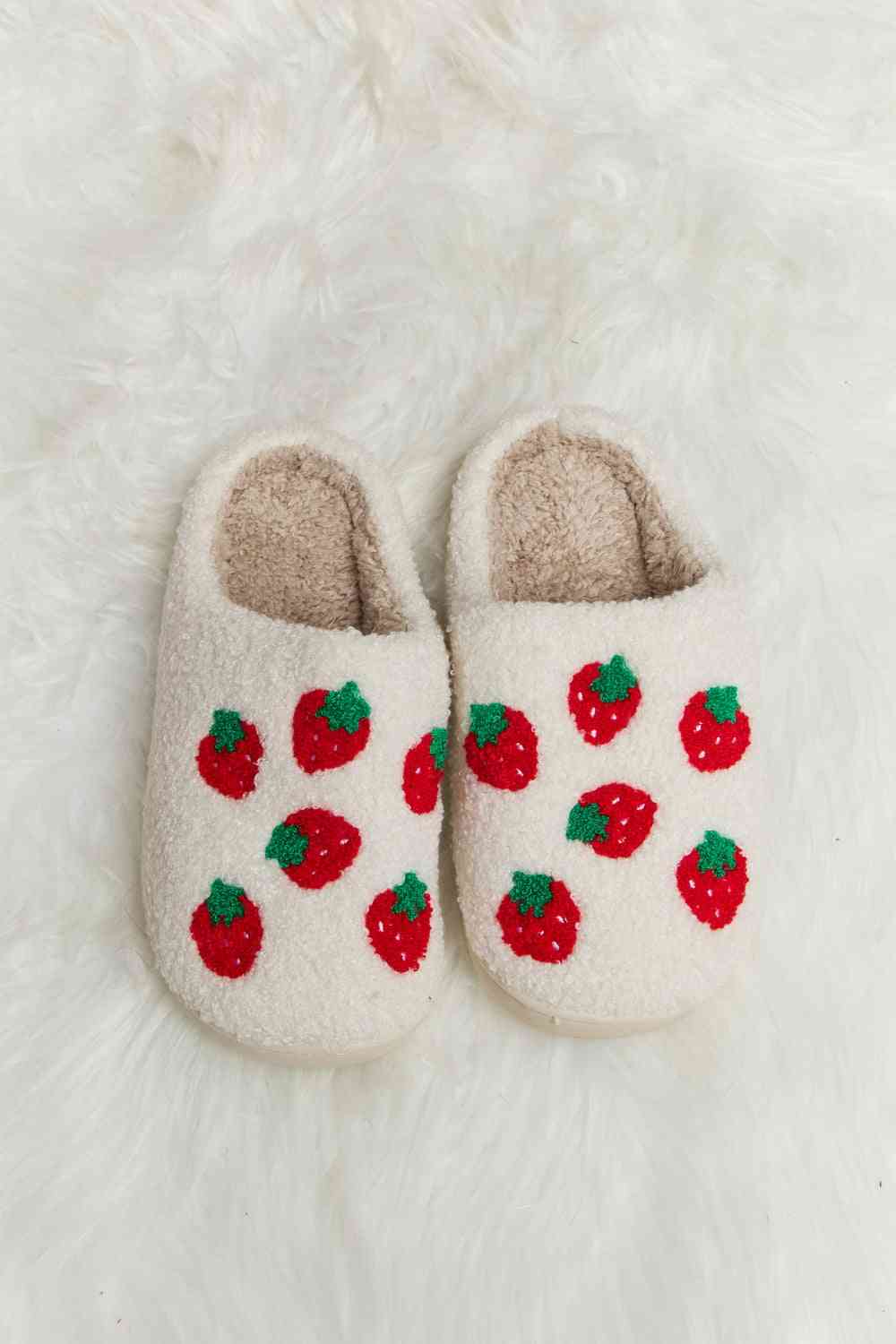 A pair of Comfy Cozy Plush Slide Slippers featuring a soft faux fur top and a durable rubber sole, perfect for indoor and outdoor use.