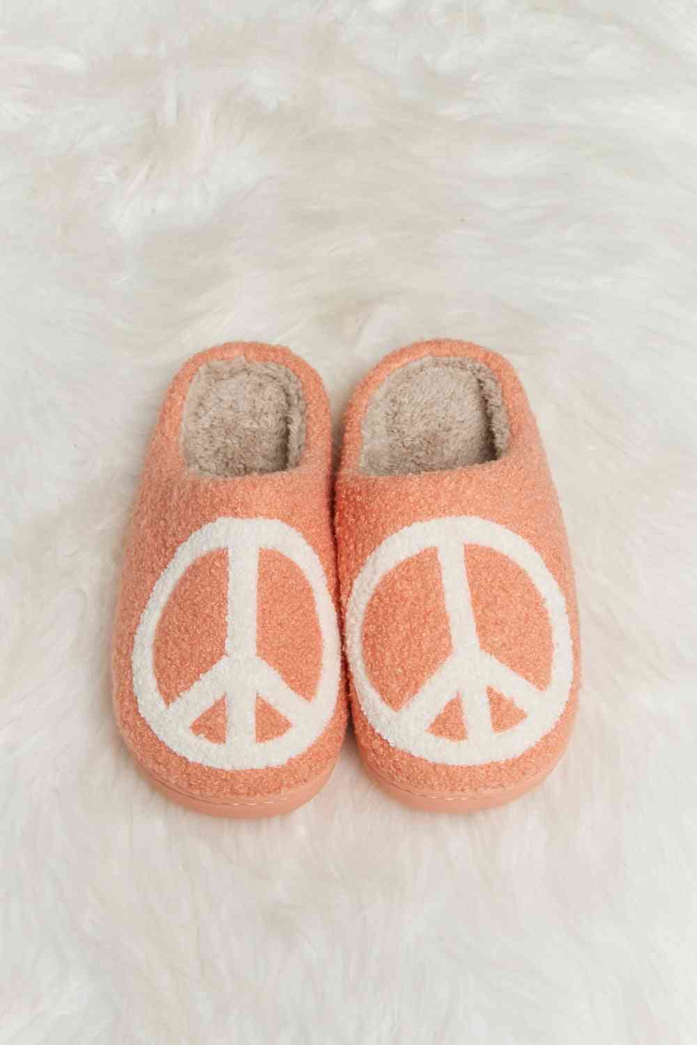 A pair of Comfy Cozy Plush Slide Slippers featuring a soft faux fur top and a durable rubber sole, perfect for indoor and outdoor use.