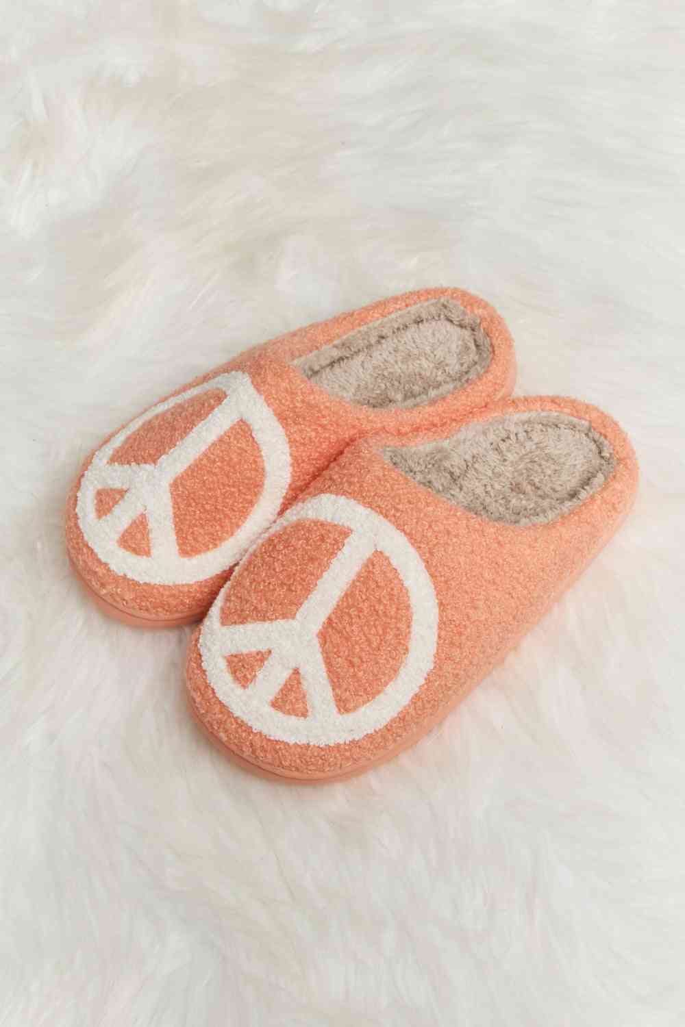 A pair of Comfy Cozy Plush Slide Slippers featuring a soft faux fur top and a durable rubber sole, perfect for indoor and outdoor use.