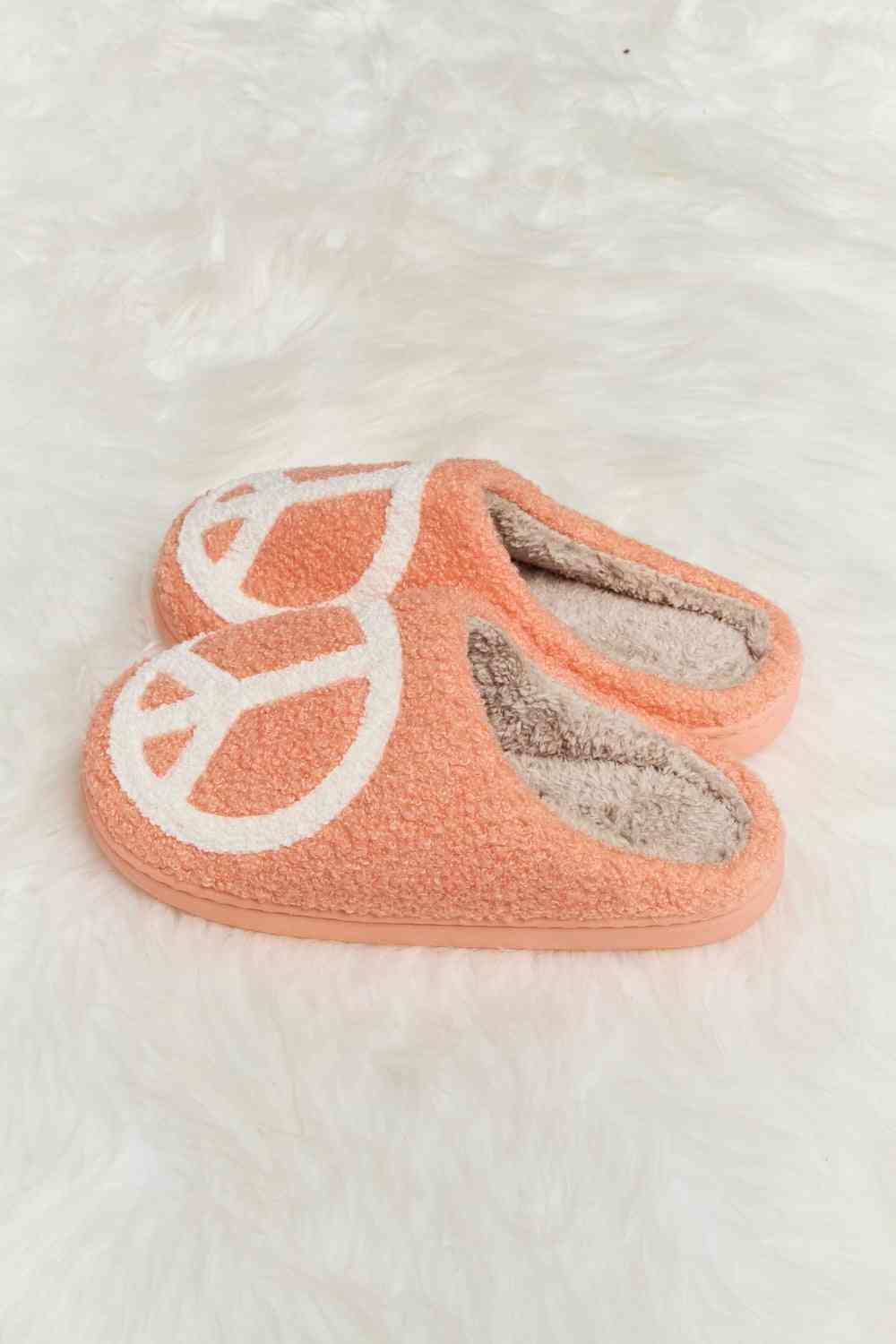 A pair of Comfy Cozy Plush Slide Slippers featuring a soft faux fur top and a durable rubber sole, perfect for indoor and outdoor use.