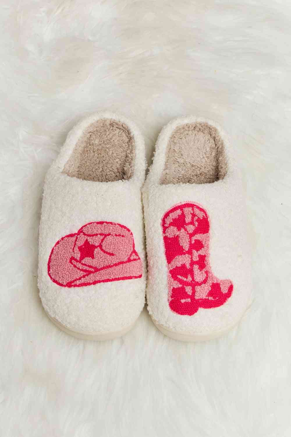 A pair of Comfy Cozy Plush Slide Slippers featuring a soft faux fur top and a durable rubber sole, perfect for indoor and outdoor use.