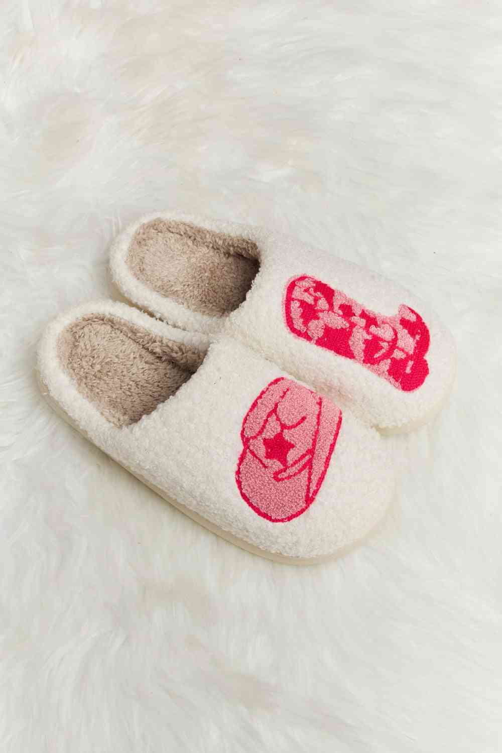 A pair of Comfy Cozy Plush Slide Slippers featuring a soft faux fur top and a durable rubber sole, perfect for indoor and outdoor use.