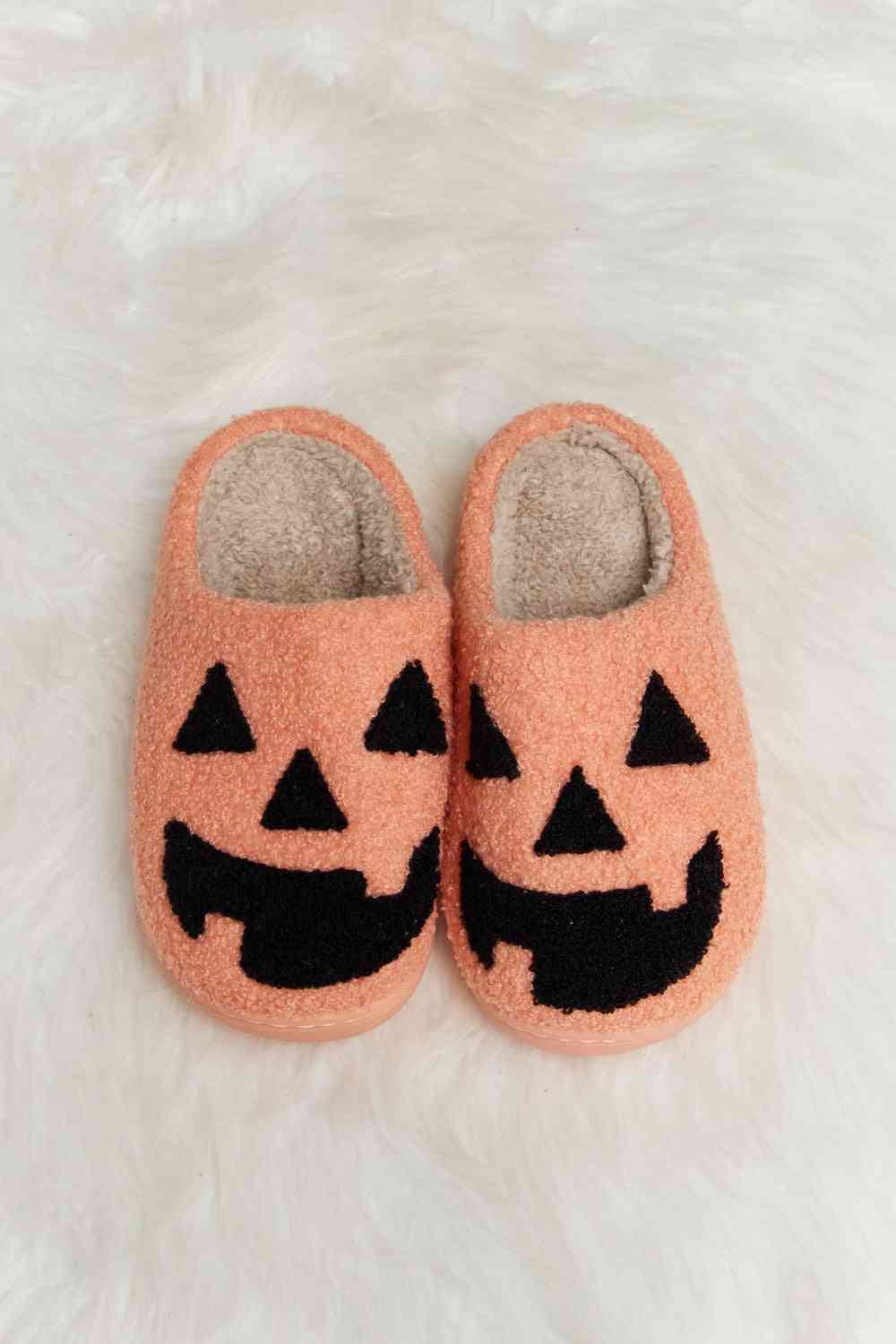 A pair of Comfy Cozy Plush Slide Slippers featuring a soft faux fur top and a durable rubber sole, perfect for indoor and outdoor use.