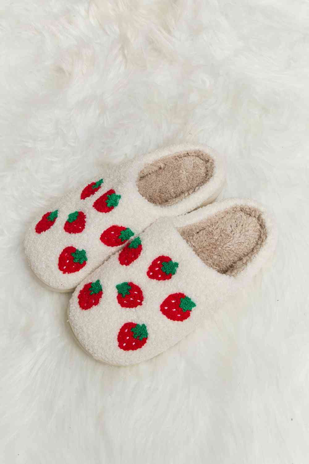 A pair of Comfy Cozy Plush Slide Slippers featuring a soft faux fur top and a durable rubber sole, perfect for indoor and outdoor use.