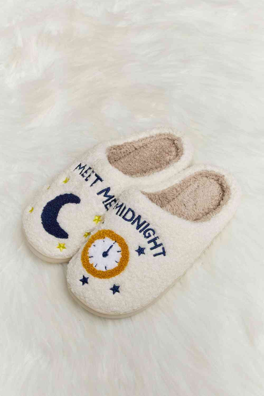 A pair of Comfy Cozy Plush Slide Slippers featuring a soft faux fur top and a durable rubber sole, perfect for indoor and outdoor use.