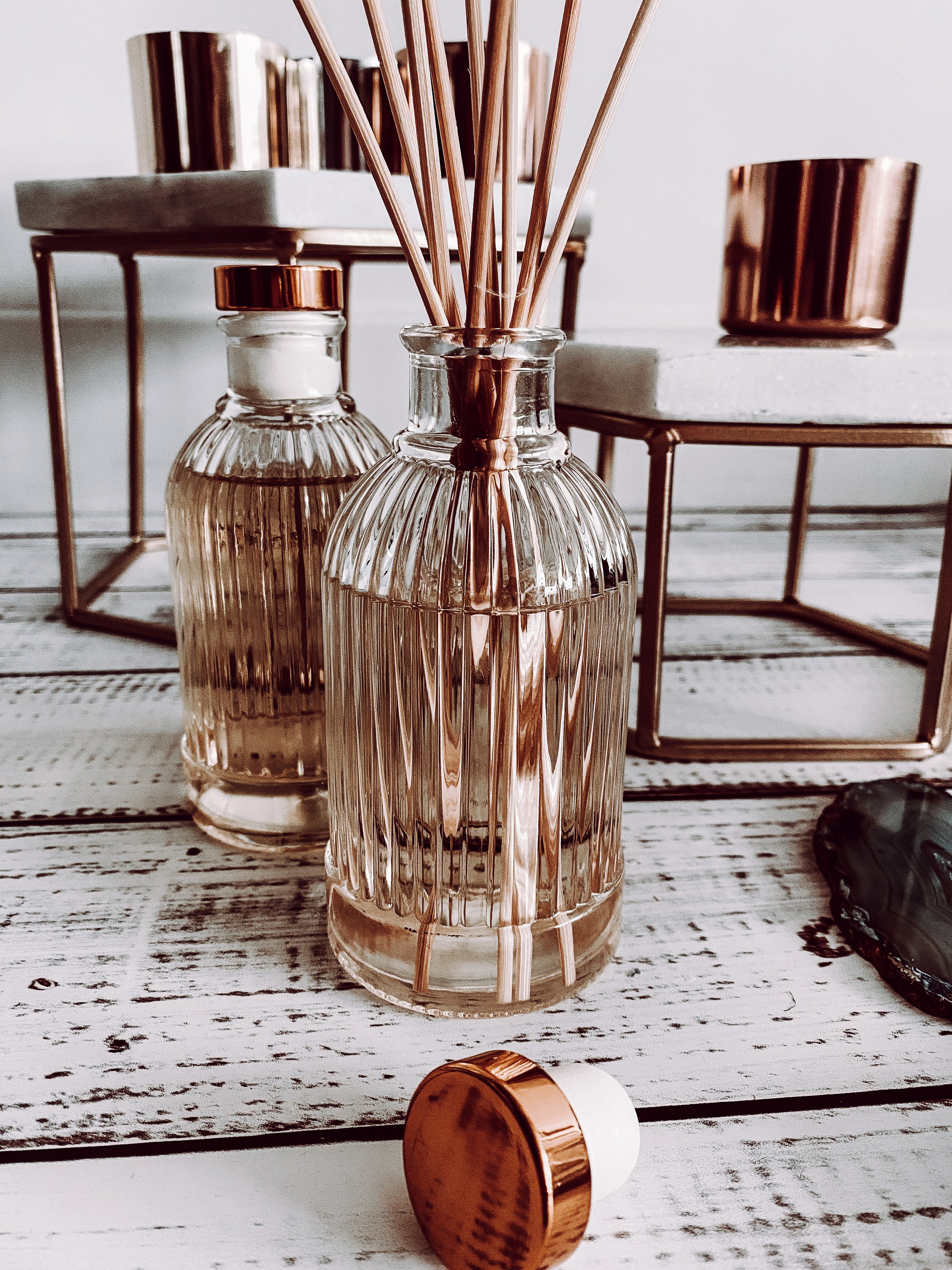 Dark Amber & Sandalwood Reed Diffuser in a stylish glass bottle with rattan reed sticks, showcasing a warm and earthy fragrance.