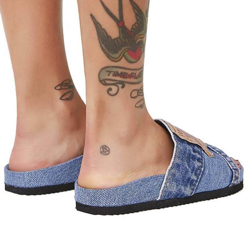 Denim Women's Cool Round Head Flat Slides in blue and black, showcasing a stylish round head design and comfortable flat sole.