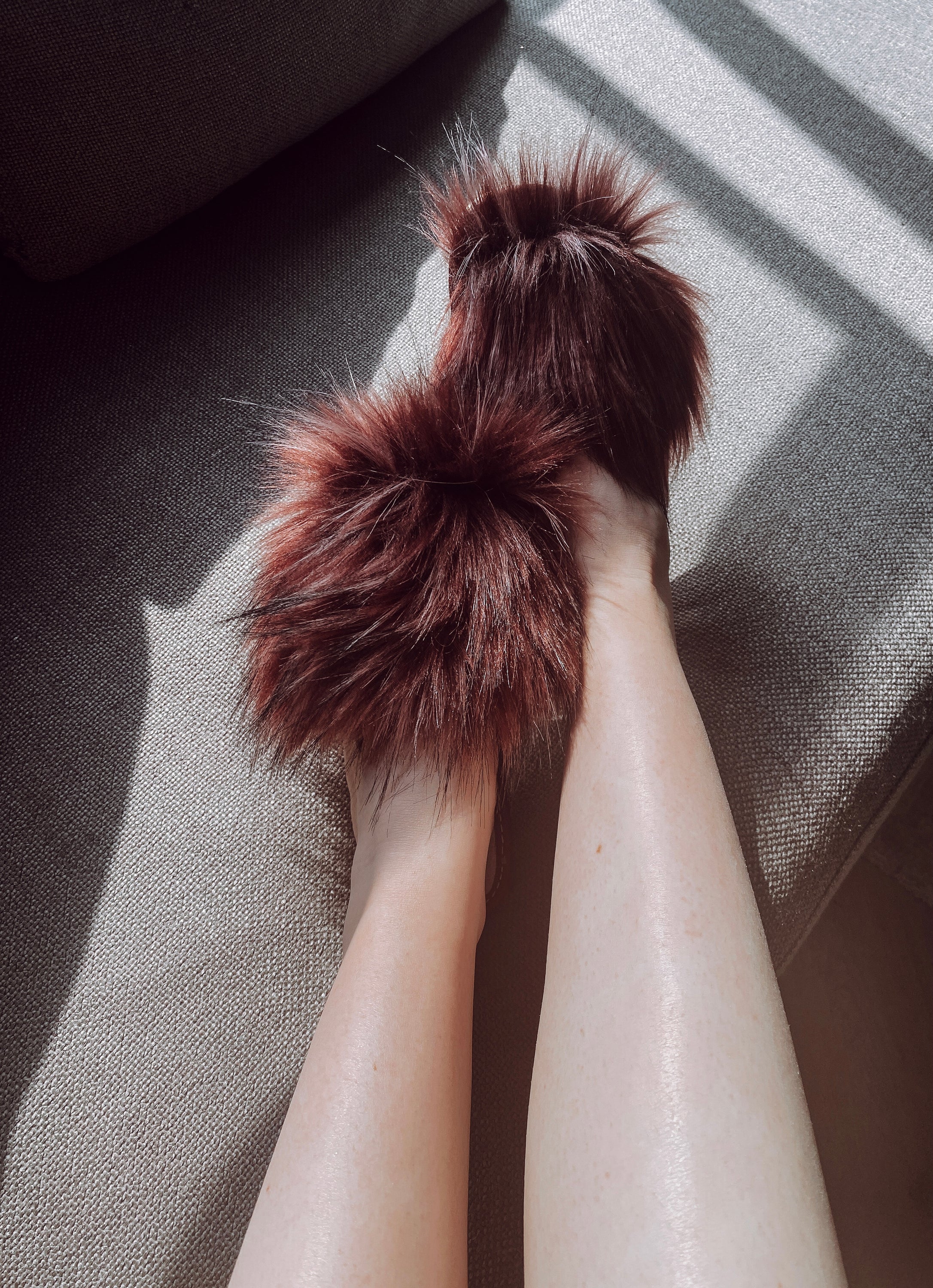 Cozy faux fur pink slippers with cushioned insole and foam bottom, perfect for home wear.